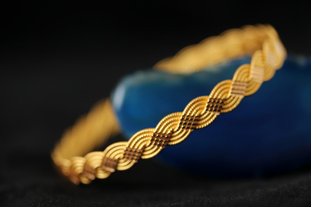 Gold bracelet on blue agate stone