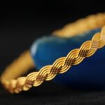 Gold bracelet on blue agate stone